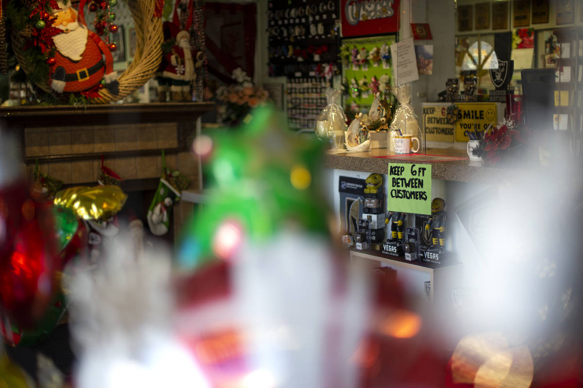 Signs ask for customers to stand apart to prevent the spread of coronavirus at DiBella Flowers ...