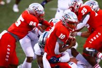 New Mexico Lobos quarterback Trae Hall (10) runs the ball against UNR during the first half of ...