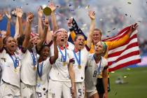 United States' Megan Rapinoe holds the trophy celebrating at the end of the Women's World Cup f ...