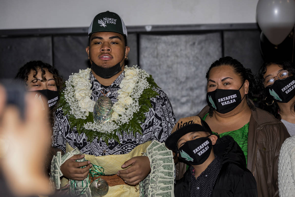 Desert Pines high school nose tackle Fatafehi Vailea singing with North Texas University, is ph ...