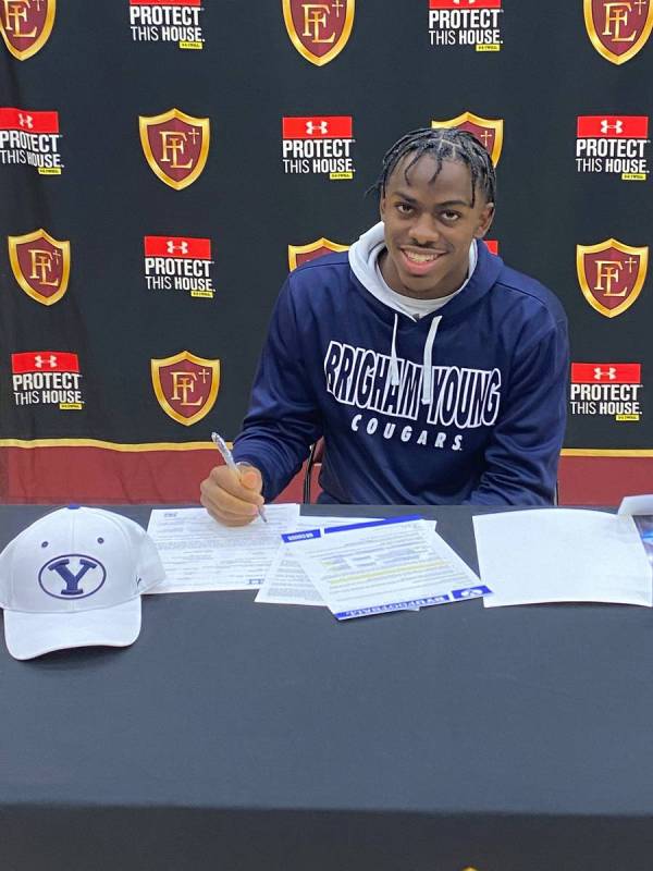Faith Lutheran wide receiver Quenton Rice signs to play football at Brigham Young on Wednesday. ...