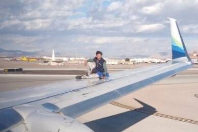 Alejandro Carlson was arrested after he climbed onto a commercial aircraft’s wing as it was p ...