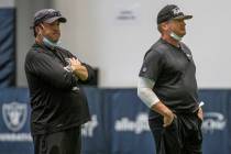 Las Vegas Raiders head coach Jon Gruden, right, stands with defensive coordinator Paul Guenther ...