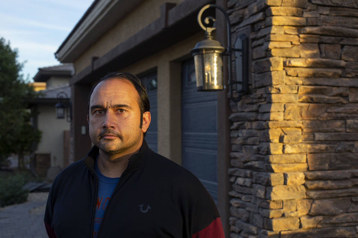 Amit Malik stands for a portrait outside the home he was evicted from in November on Tuesday, D ...