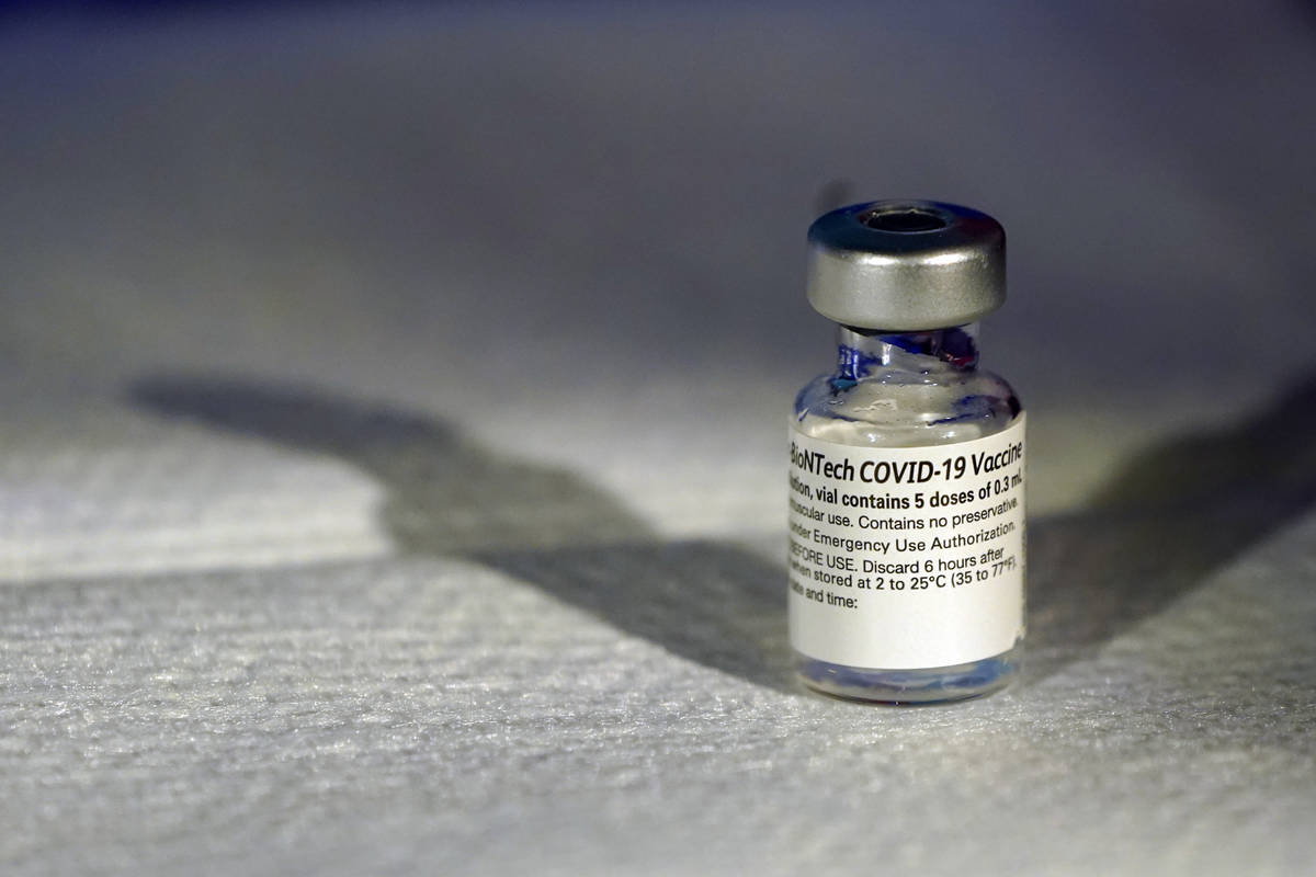 A vial of Pfizer's COVID-19 vaccine that receivedemergency use authorization is seen at George ...