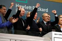 Hewlett Packard Enterprise President & CEO Antonio Neri, right, rings the New York Stock Exchan ...