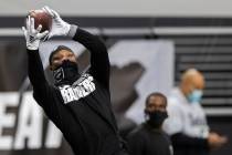 Raiders wide receiver Henry Ruggs III (11) warms up before the start of an NFL football game ag ...