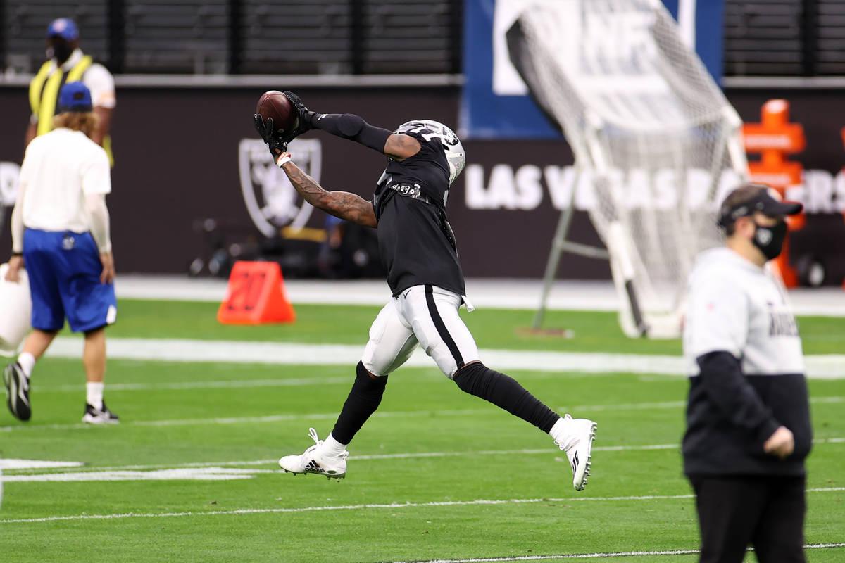 Raiders wide receiver Henry Ruggs III (11) makes a catch before the start of an NFL football ga ...