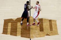 Alex Davis, left, of Fresno State and Alex Kirk of New Mexico shake hands while standing on the ...