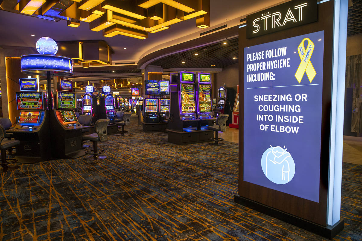 A hygiene reminder greets potential guests on the casino floor at the Strat on Wednesday, Dec. ...