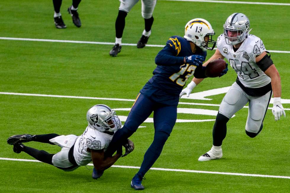 Las Vegas Raiders free safety Lamarcus Joyner (29) tries to bring down Los Angeles Chargers wid ...