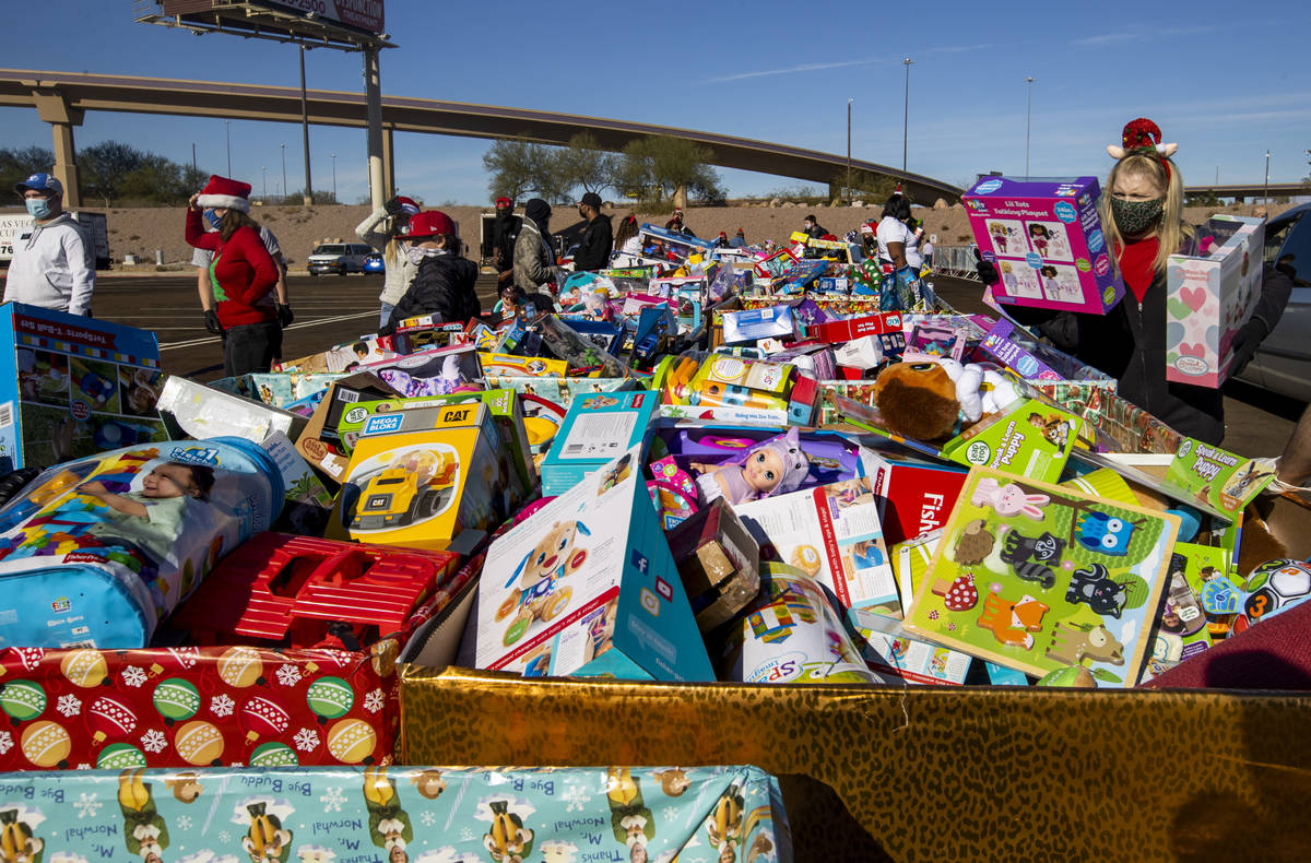 Boxes of toys for all kidÕs ages are ready to be given out by volunteers as the Las Vegas ...