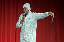 Brad Garrett is shown wearing his protective hazmat suit at the reopening of his Brad Garrett's ...