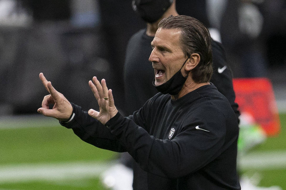 Raiders offensive coordinator Greg Olson calls a play during warm ups before an NFL football ga ...