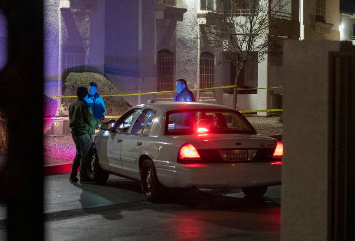 Police investigate a homicide Wednesday, Dec. 16, 2020, at Pacific Legends Apartments, 1405 S. ...