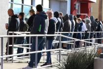 People wait in line at One-Stop Career Center in Las Vegas in March 2020. (Bizuayehu Tesfaye/La ...