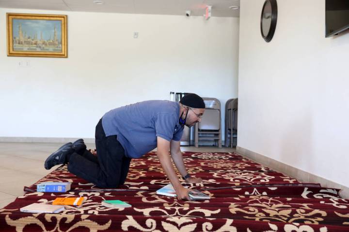 Shamsuddin Waheed, imam at Masjid Ibrahim in Las Vegas, places carpet in a social hall in Octob ...