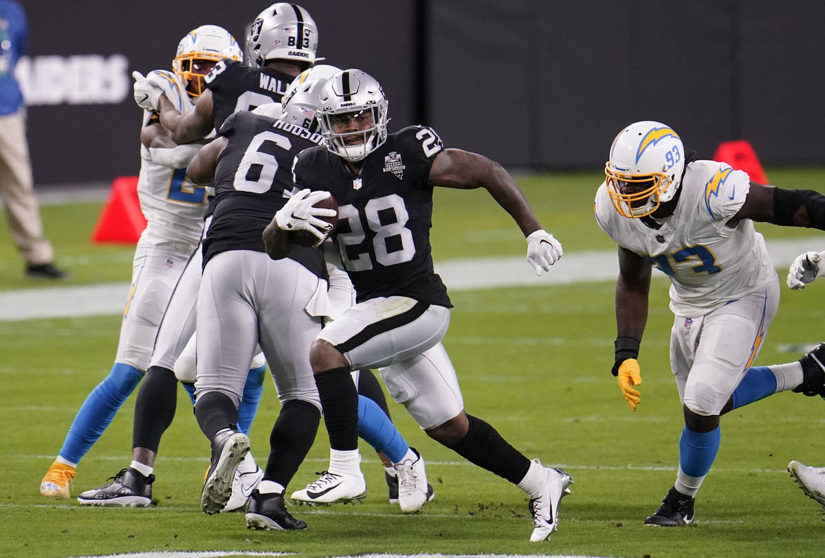 Las Vegas Raiders running back Josh Jacobs #28 rushes during the first quarter against the Los ...