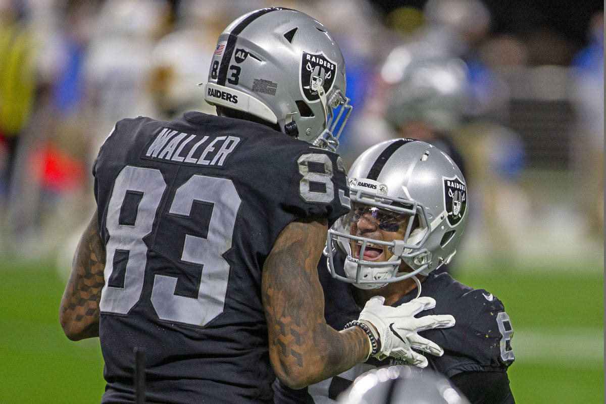Raiders tight end Darren Waller (83) celebrates his touchdown with quarterback Marcus Mariota ( ...