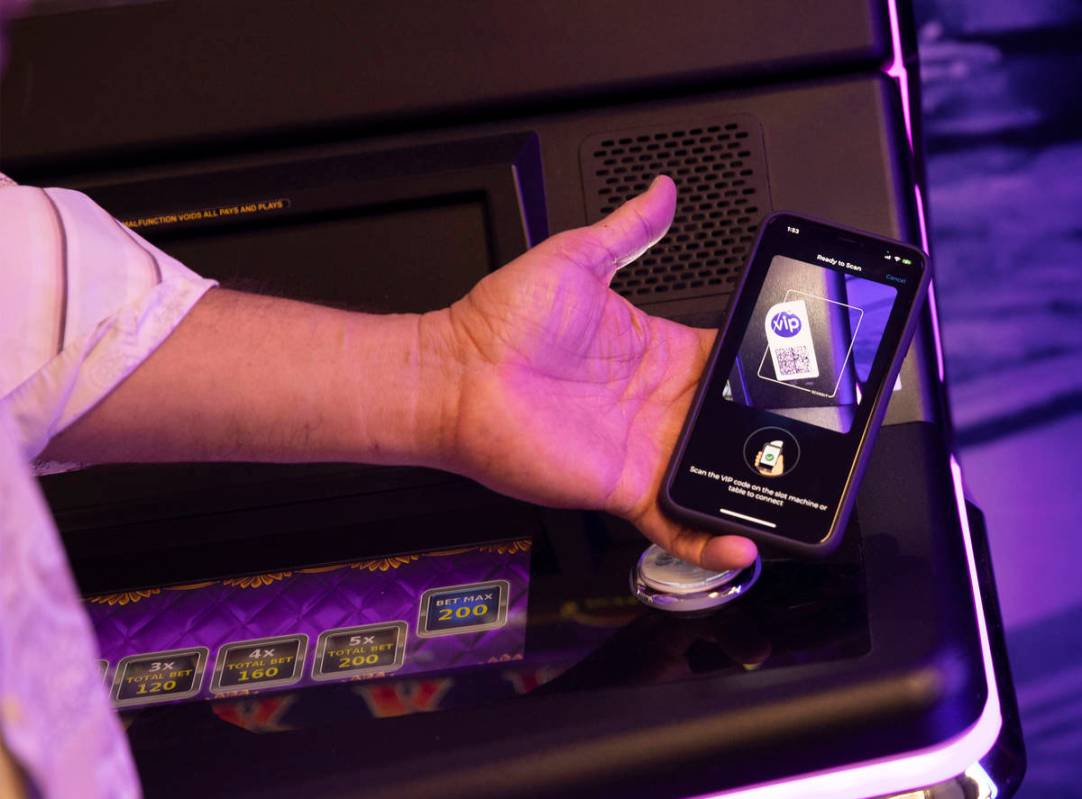 Christopher Justice, president of Global Payments Gaming Solutions, shows the Review-Journal a ...
