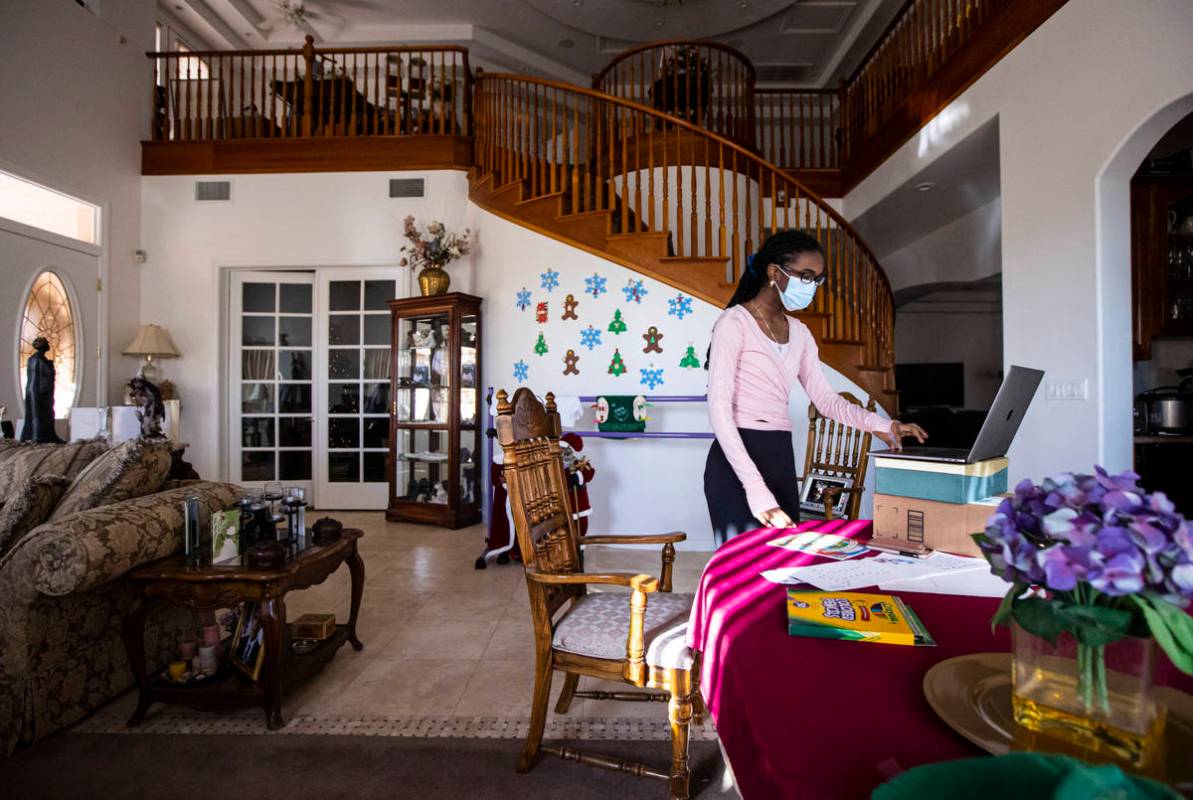 Dre Boyd-Weatherly, a junior at Valley High School, leads a Books and Ballet class from her hom ...