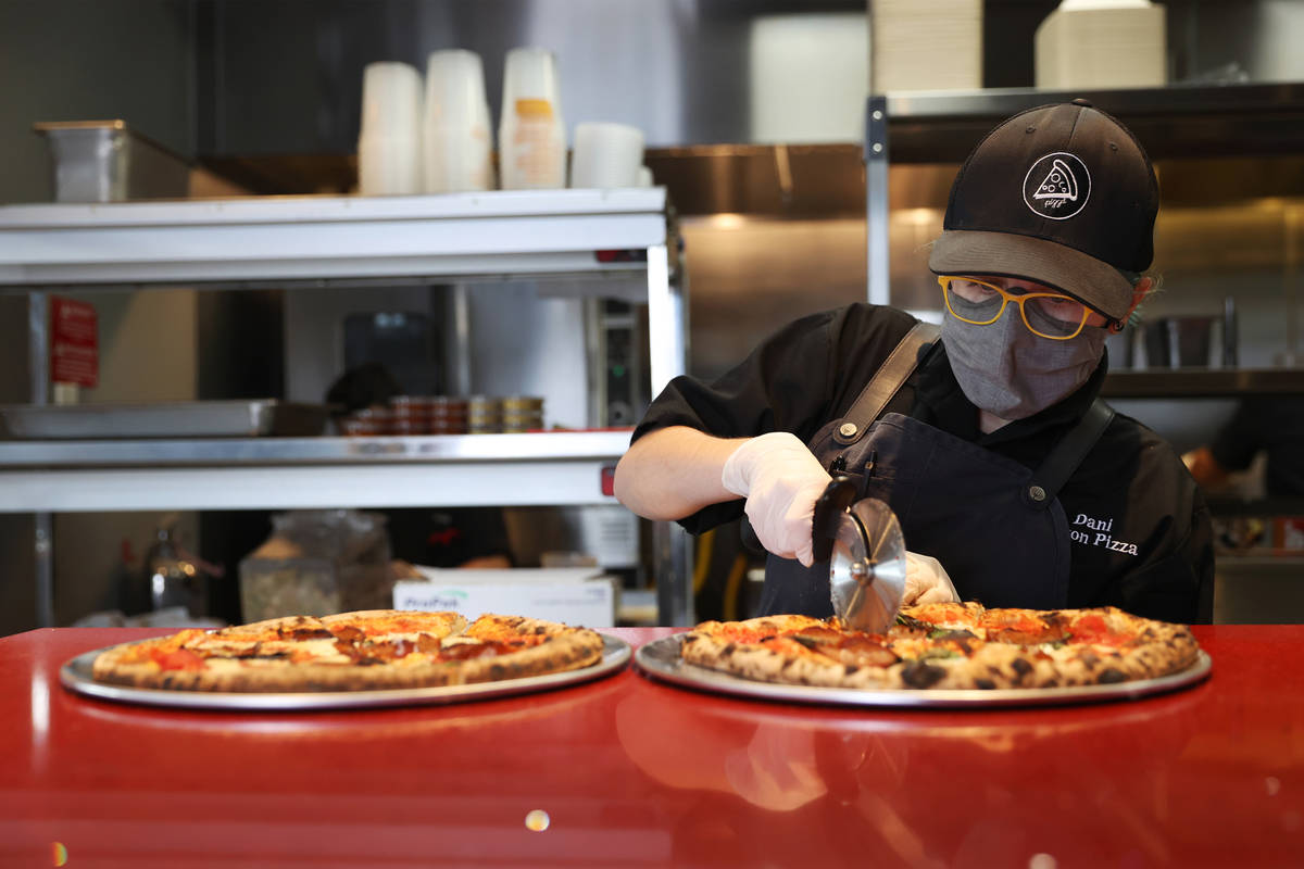 Dani Garcia-White of Yukon Pizza prepares a pizza order at Vegas Test Kitchen in Las Vegas on S ...