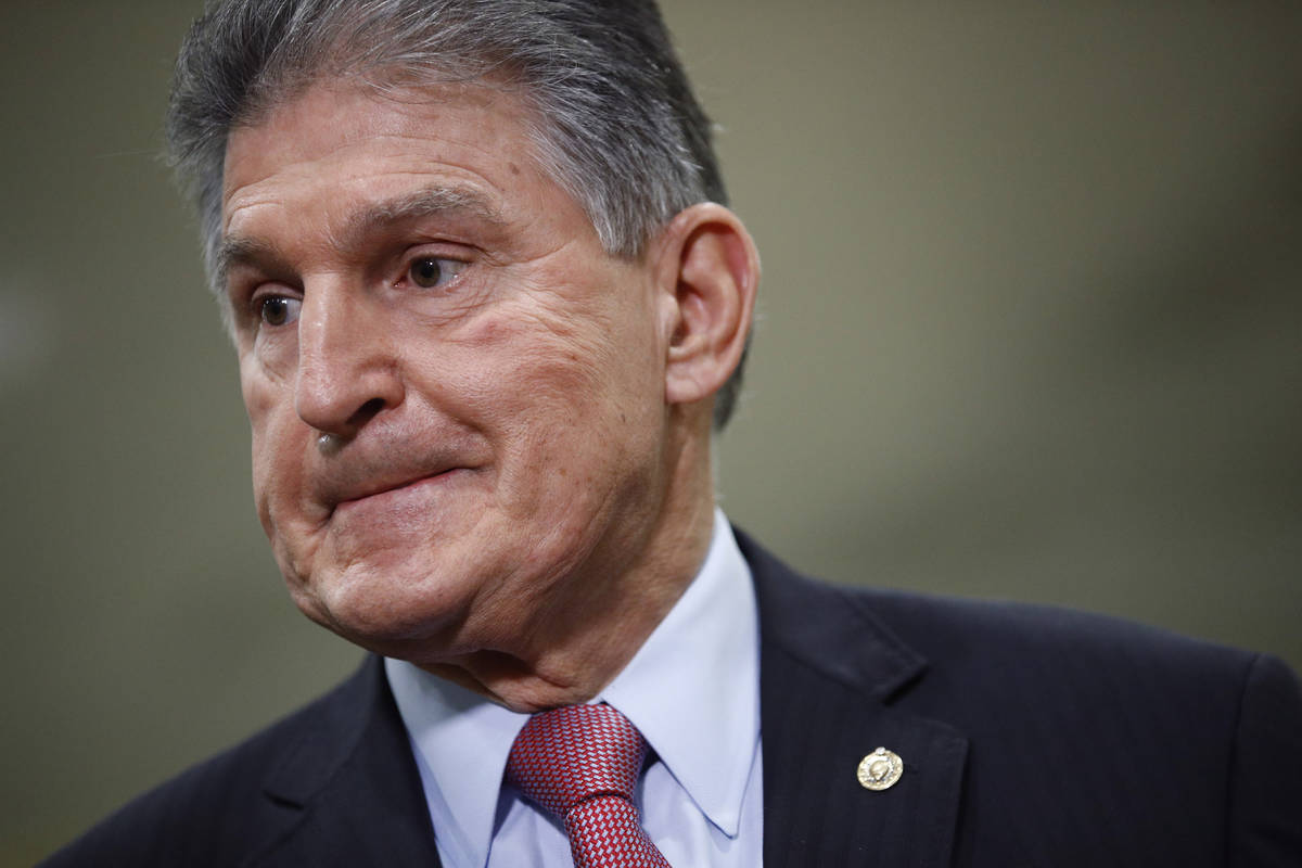 FILE - In this Feb. 5, 2020, file photo, Sen. Joe Manchin, D-W.Va., speaks with reporters on Ca ...
