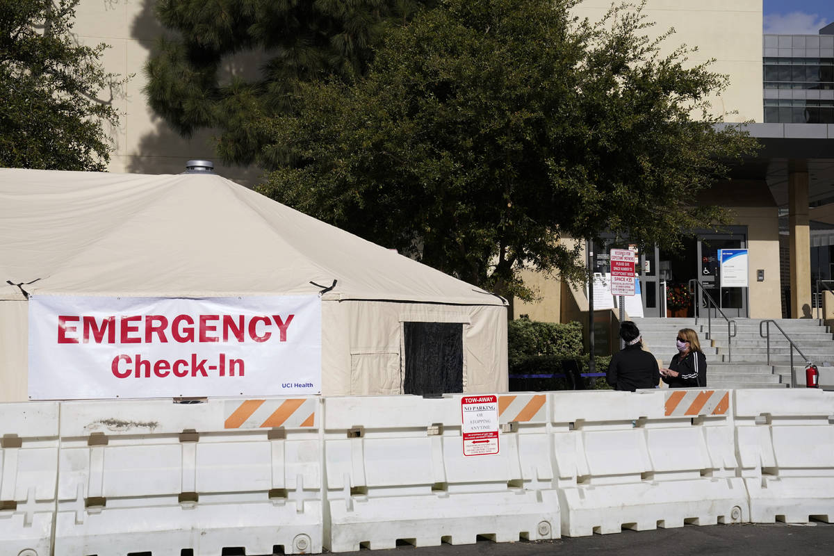 FILE - In this Dec. 17, 2020, file photo, medical tents are set up outside the emergency room a ...