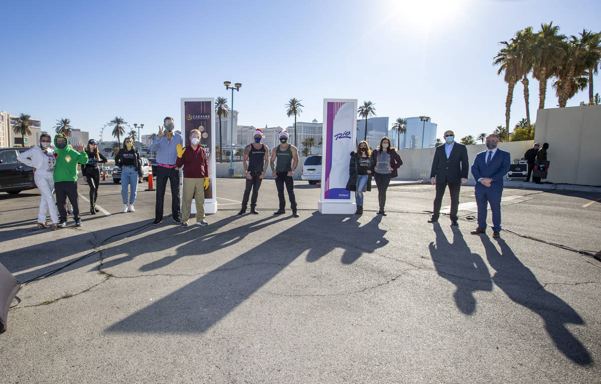 Performers and executives gather during the re-opening of the Rio on Tuesday, Dec. 22, 2020, in ...
