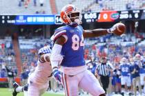 FILE - Florida Gators tight end Kyle Pitts (84) scores a touchdown during an NCAA college footb ...