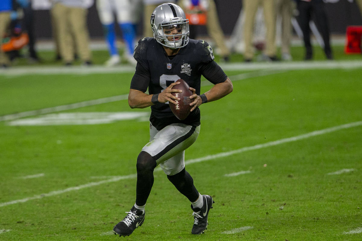 Raiders quarterback Marcus Mariota (8) runs with the football during the fourth quarter of an N ...