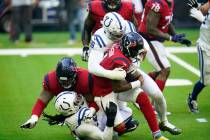 Indianapolis Colts defensive tackle DeForest Buckner (99) joins in on a sack during an NFL foot ...