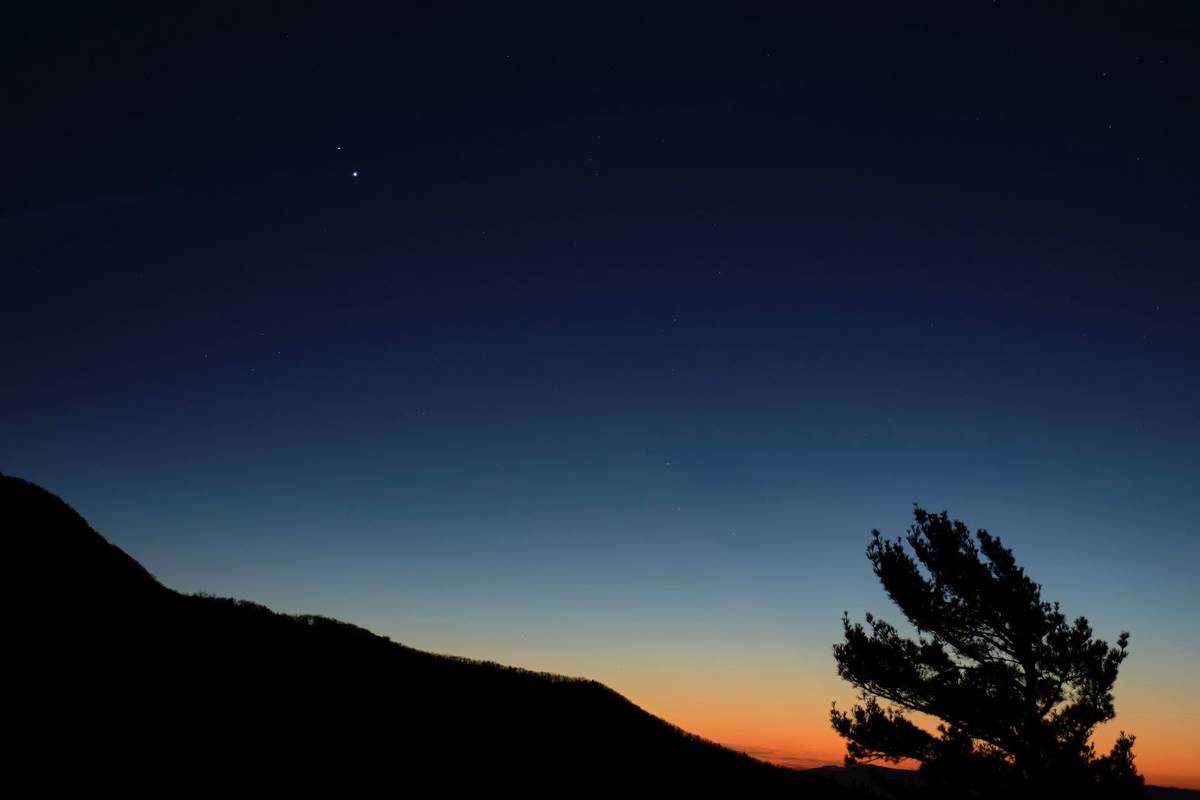 Saturn, top, and Jupiter, below, are seen after sunset from Shenandoah National Park in Luray, ...