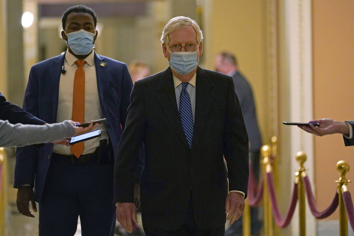 Senate Majority Leader Mitch McConnell of Ky., walks past reporters on Capitol Hill in Washingt ...