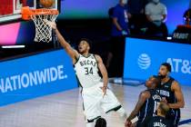Milwaukee Bucks' Giannis Antetokounmpo (34) drives to the basket during the first half of an NB ...
