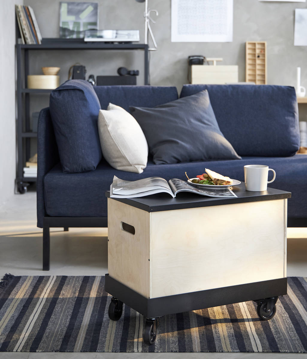 The Ravaror birch storage boxes can be stacked for storage or used as rolling tables. The blue ...