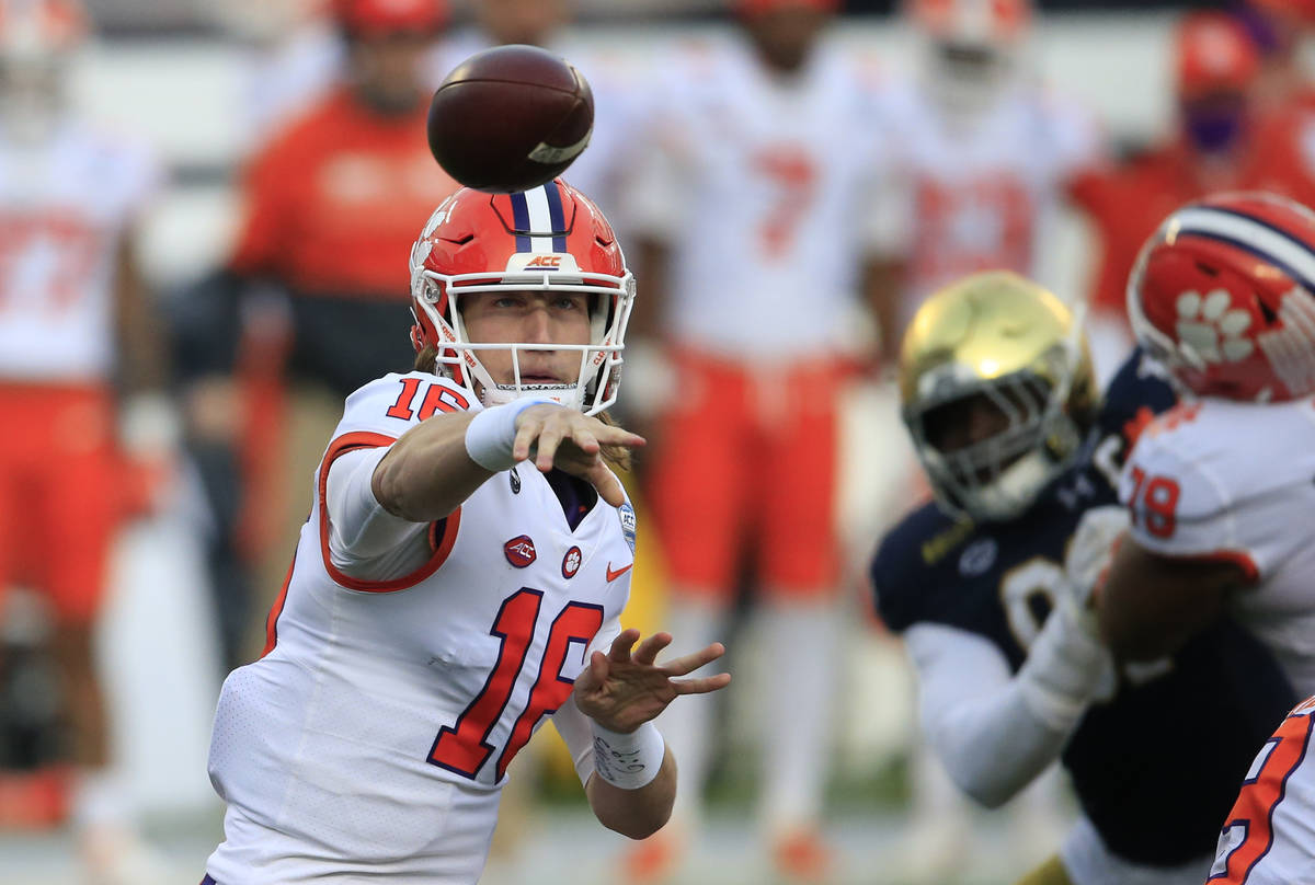 Clemson quarterback Trevor Lawrence (16) throws to an open receiver during the first half of th ...