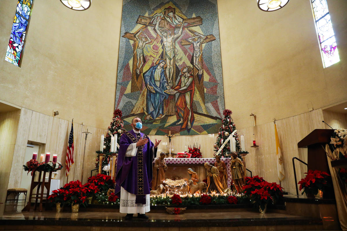 Father Miguel Corral delivers a sermon during Mass at St. Anne's Catholic Church in Las Vegas, ...