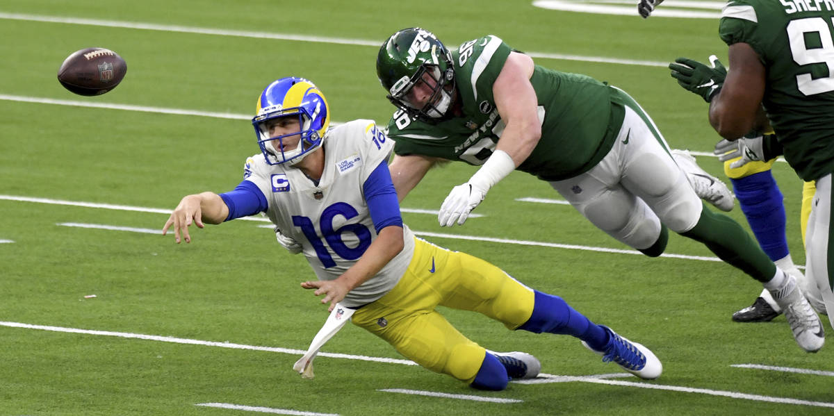 Los Angeles Rams quarterback Jared Goff (16) tries to pass as New York Jets defensive end Henry ...