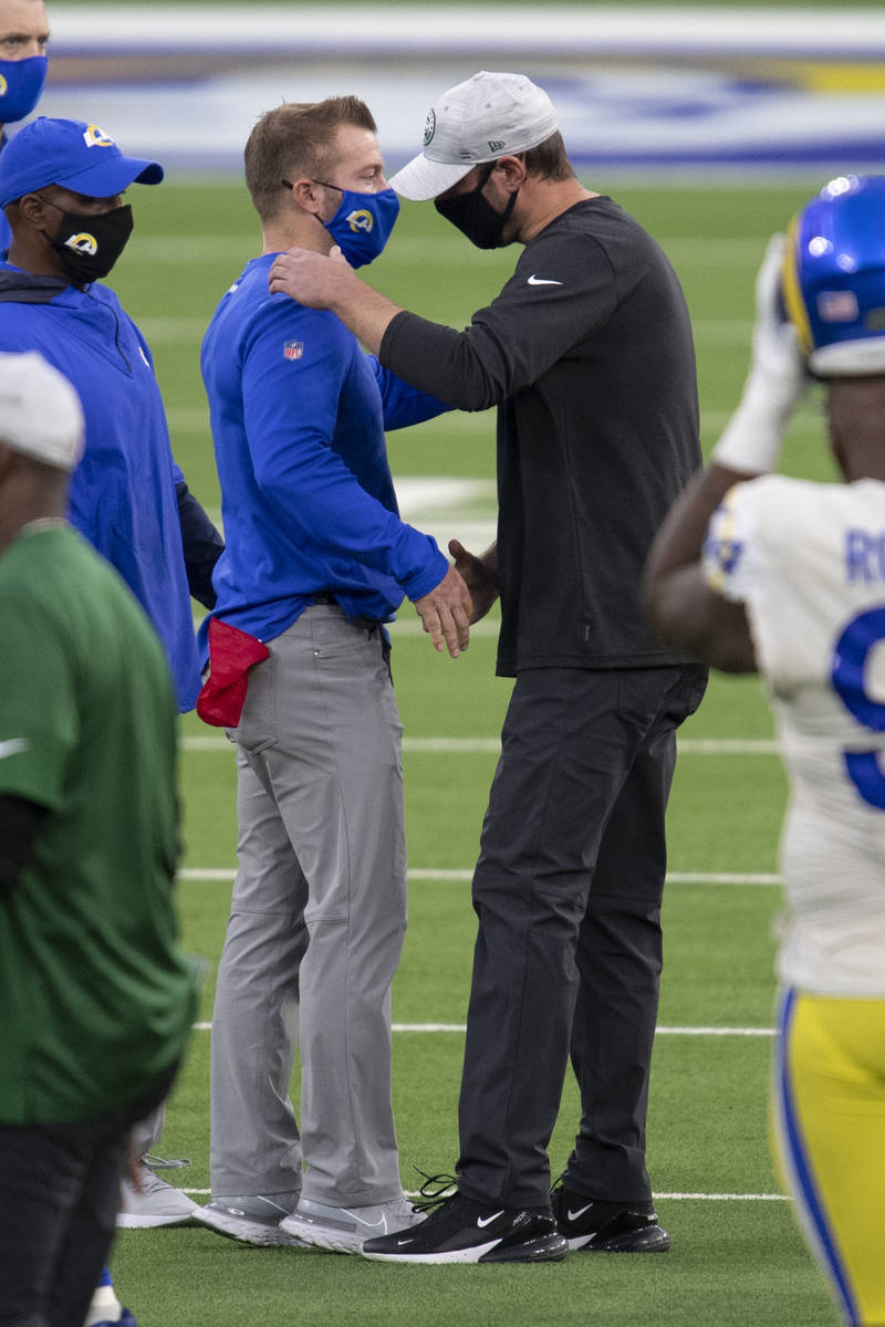 New York Jets head coach Adam Gase, right, shakes hands with Los Angeles Rams head coach Sean M ...