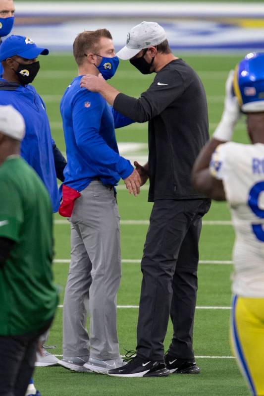 New York Jets head coach Adam Gase, right, shakes hands with Los Angeles Rams head coach Sean M ...