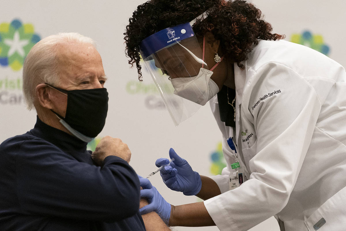 President-elect Joe Biden receives his first dose of the coronavirus vaccine from Nurse partiti ...