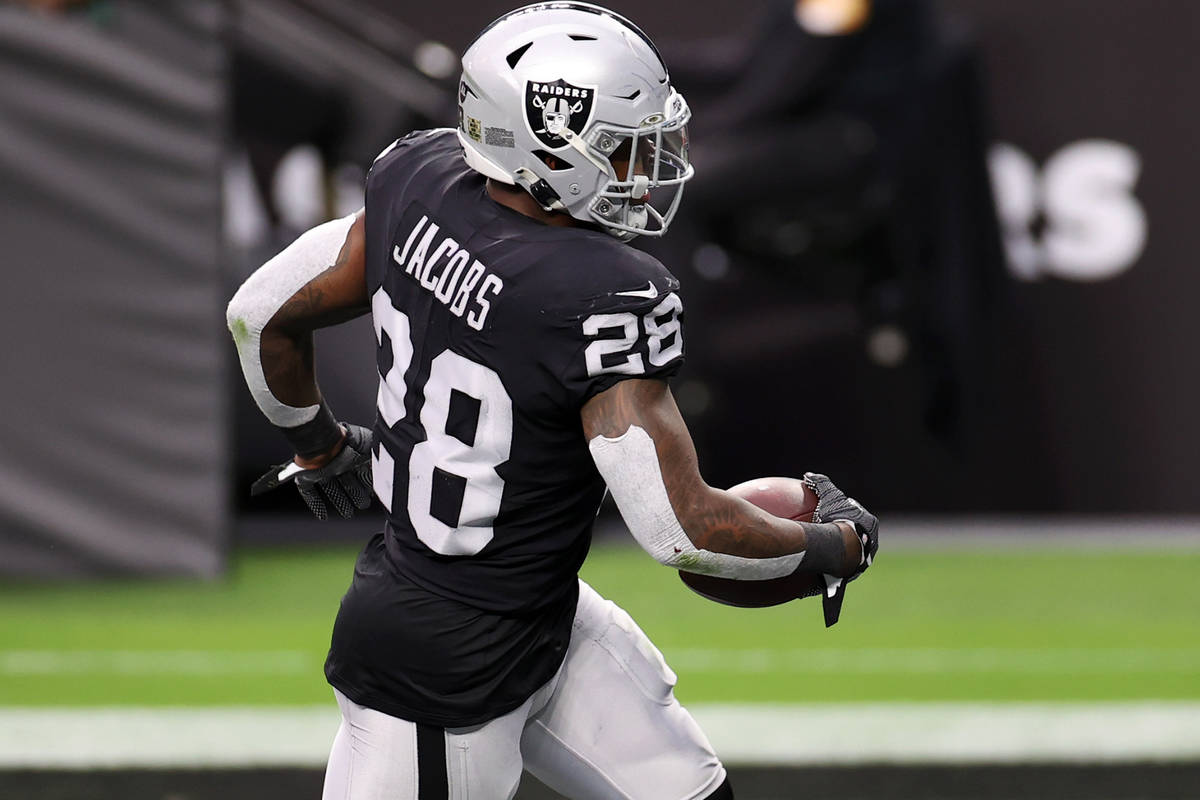 Las Vegas Raiders running back Josh Jacobs (28) rushes the ball for a touchdown against the Den ...