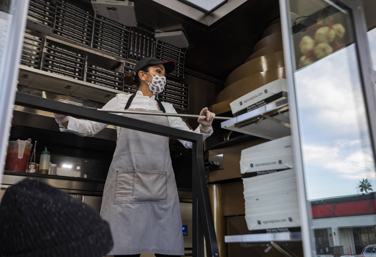 Chef Floriana Pastore is seen in the Signora Pizza Truck parked in the the Pinball Hall parking ...