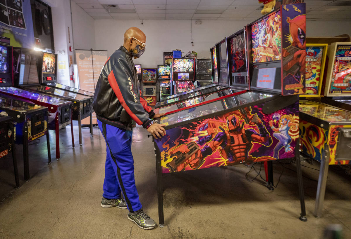 Oliver Blair, 46, of San Antonio, Texas, plays games at the Pinball Hall of Fame, during the la ...