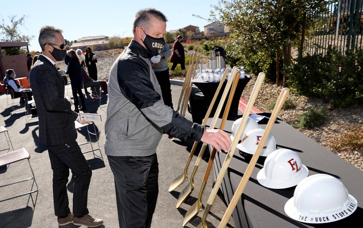 Dr. Steve Buuck, Faith Lutheran Middle School and High School CEO, grabs a shovel during a grou ...