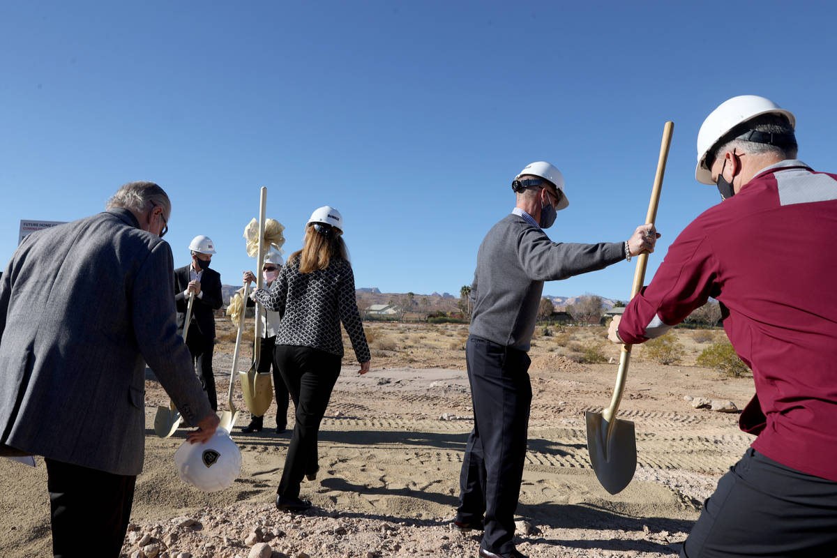 Dignitaries grab shovels during a groundbreaking ceremony for Faith Lutheran Middle School and ...
