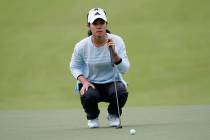 Danielle Kang lines up a putt on the first hole during the third round of the U.S. Women's Open ...