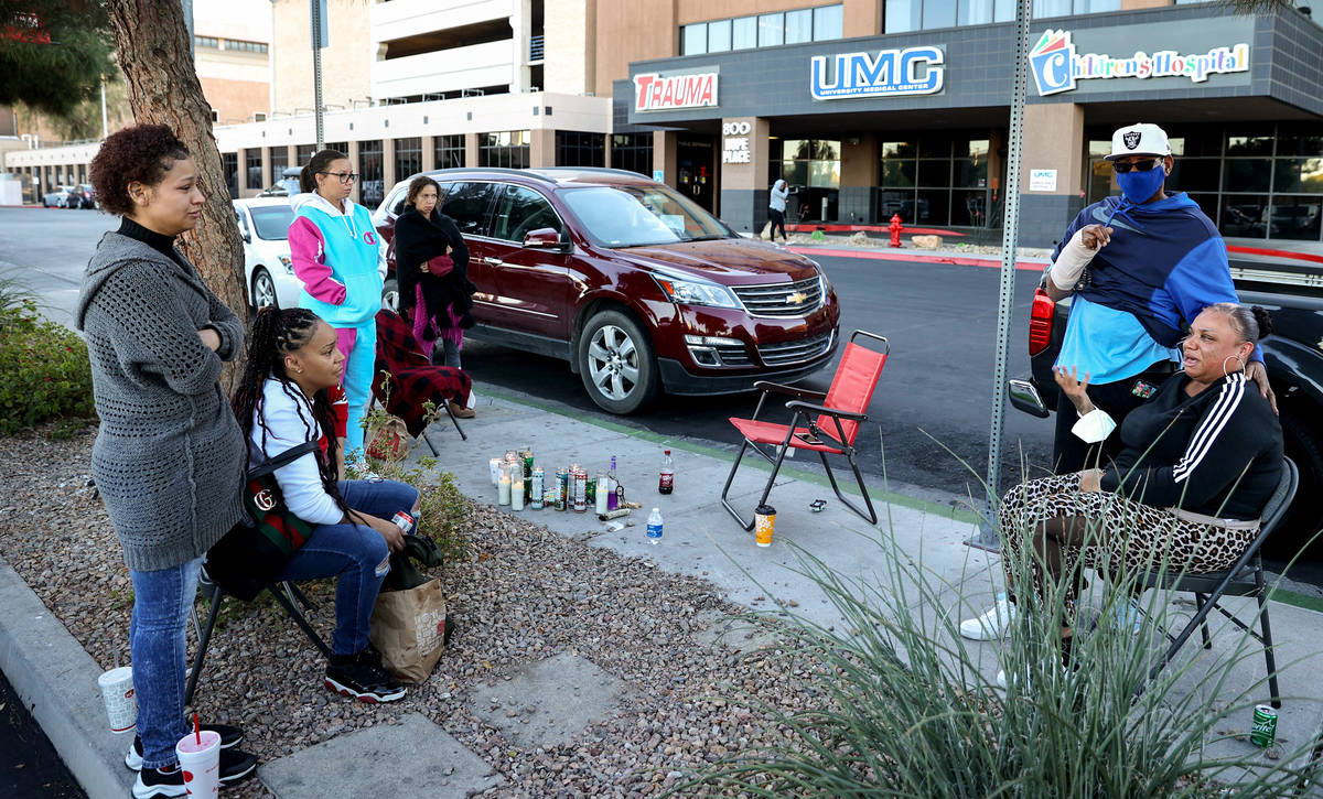 Fortashia Davis, 28, right, is comforted by her brother Ira Hairston as she cries for her broth ...