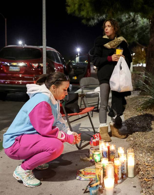 Family members of Vinston Fortee Davis Jr., 26, including cousins Unique Hairston, 36, left, an ...